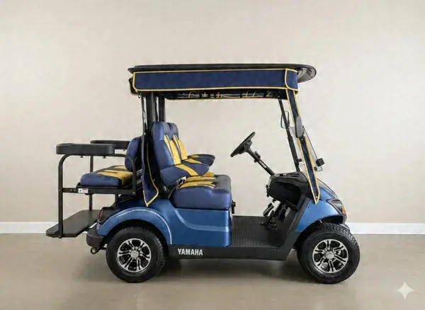Side view of a blue Yamaha golf cart with yellow seats and a rear flip seat