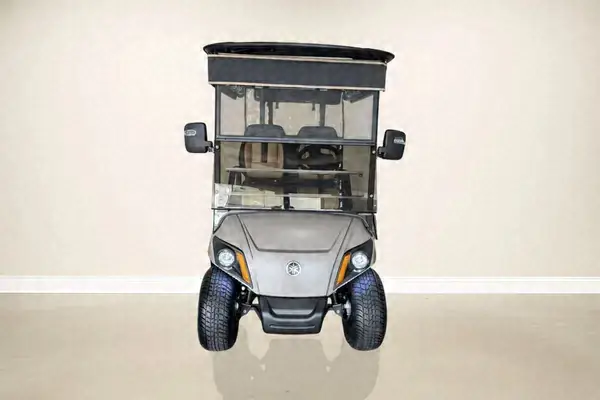 Front of a gray Yamaha golf cart with a black roof