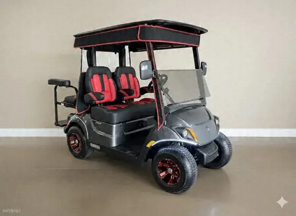 Gray Yamaha golf cart with red and black seats and red wheels