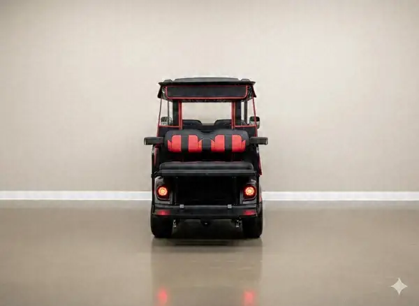 Rear of a gray golf cart with red and black rear seats and LED taillights
