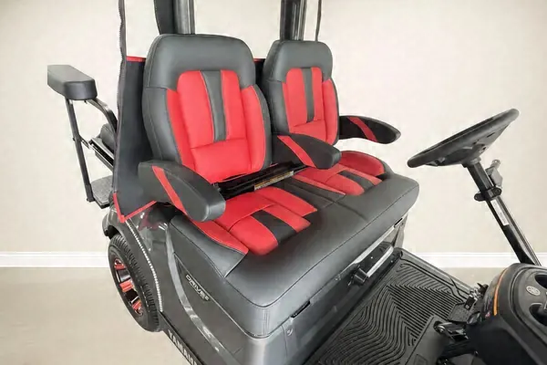 Close-up of red and black two-tone golf cart seats