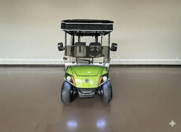Front of a lime green Yamaha golf cart with LED headlights