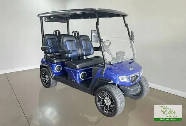Blue 4-seater golf cart with black seats and chrome wheels