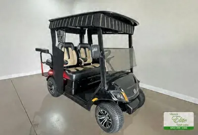 Black Yamaha 4-seater gas golf cart with tan seats