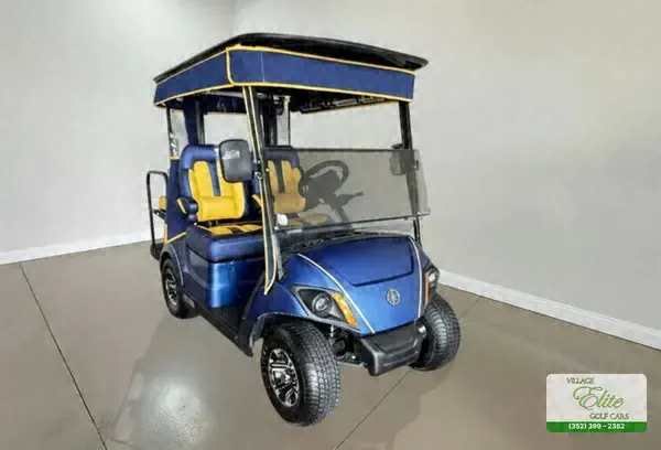 Blue Yamaha golf cart with yellow seats