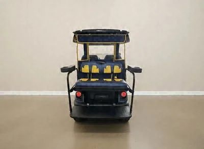 Rear of the blue Yamaha golf cart with yellow and blue rear seats