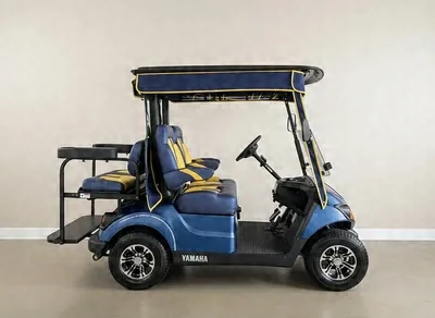 Side view of the blue Yamaha golf cart with yellow seats and a rear flip seat