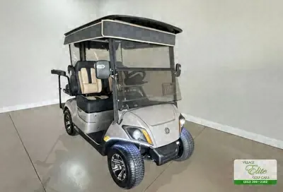Champagne Yamaha golf cart with tan seats