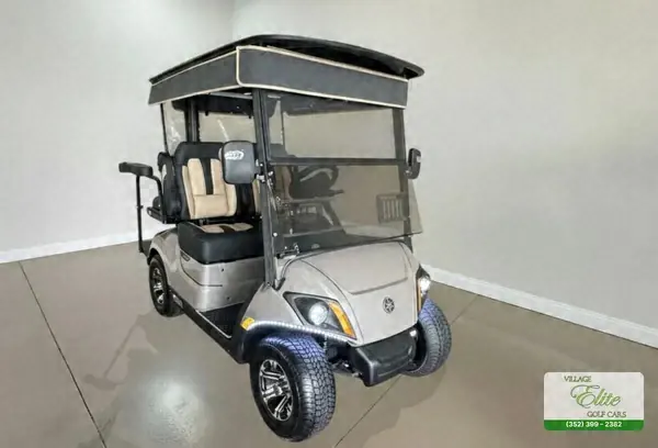 Champagne Yamaha golf cart with tan seats