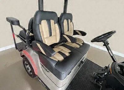 Close-up of the black and tan two-tone seats on the Yamaha Brown & Brown golf cart