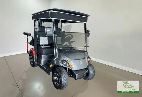 Gray Yamaha golf cart with gray seats and a black roof