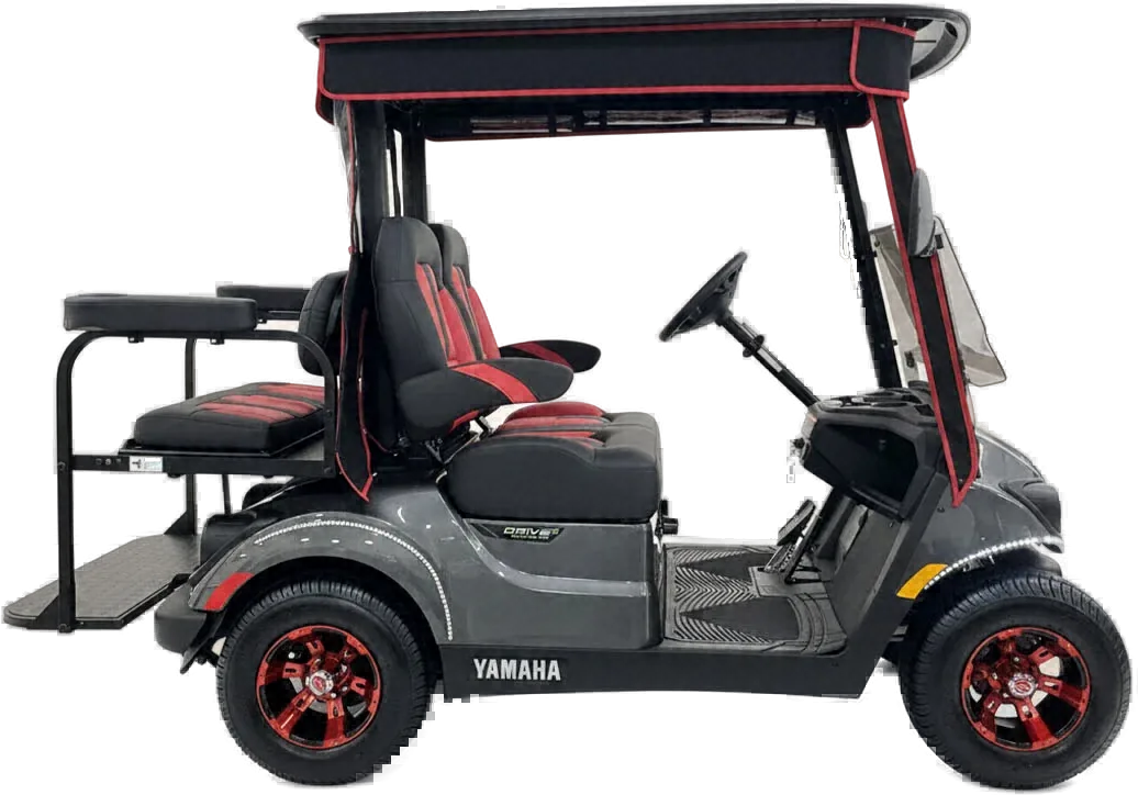 Side view of a gray Yamaha golf cart with red and black seats, red wheels and a rear flip seat