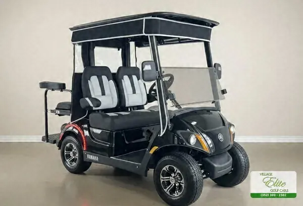 Black Yamaha 4-seater gas golf cart with silver and black seats