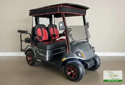Silver Yamaha golf cart with red seats and red wheels
