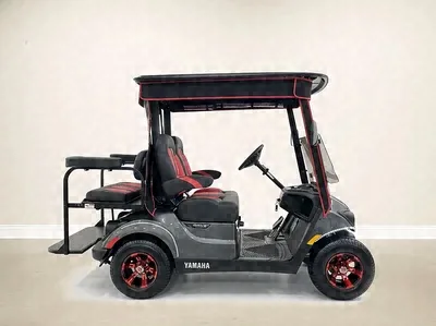 Side view of the silver Yamaha golf cart with red wheels and red trim