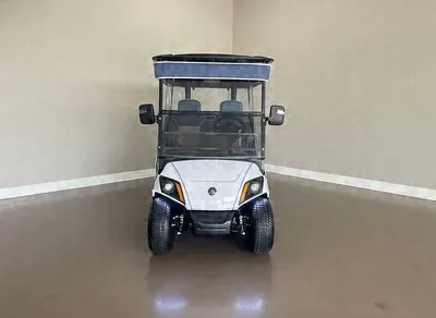 Front of the white Yamaha White & Blue golf cart with a navy roof