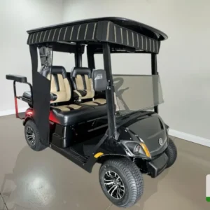 Yamaha Golf Cart Black & Tan Quadric Yamaha golf cart with black exterior and tan interior seats, 4‑seater quadric configuration.