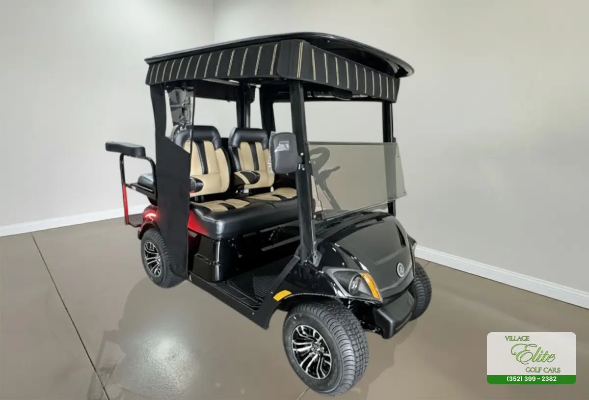 Yamaha Golf Cart Black & Tan Quadric Yamaha golf cart with black exterior and tan interior seats, 4‑seater quadric configuration.